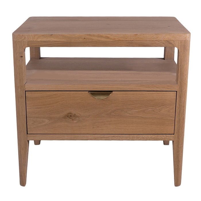 a carefully curated nightstand with niche